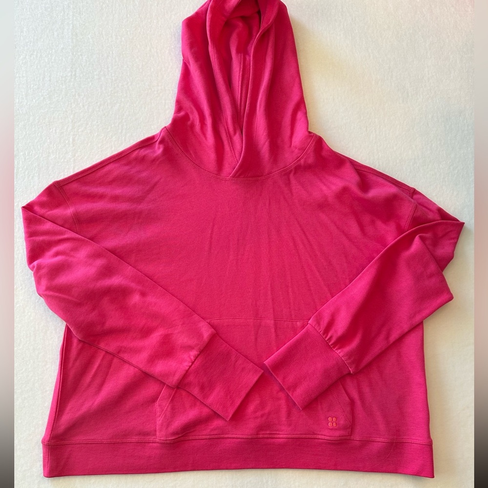 Sweaty Betty pink pullover hoodie cropped Womens size XL pouch & finger holes